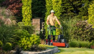 man pushing a mower