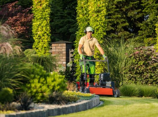 man pushing a mower